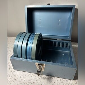 Vintage blue metal box with 5 empty 8mm film canisters